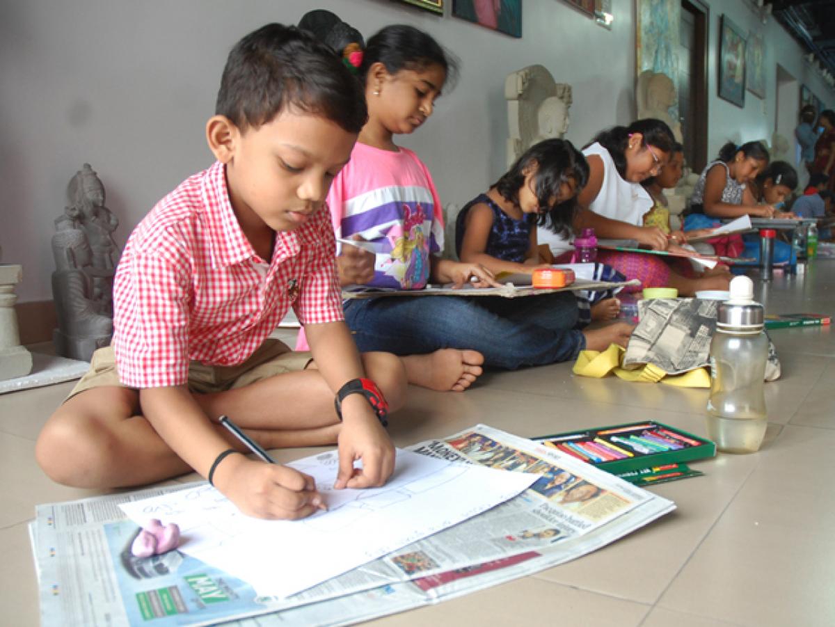 Children taking part in a drawing competition organised at Aakriti Art Gallery